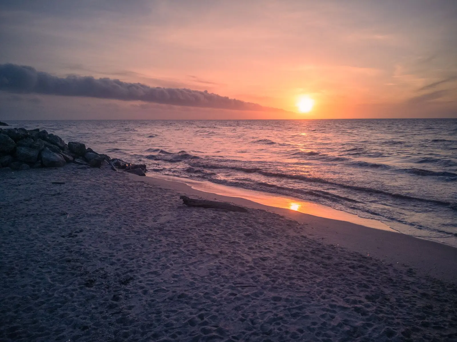 Calm ocean coastline at sunrise, a symbol of hope and new beginnings
